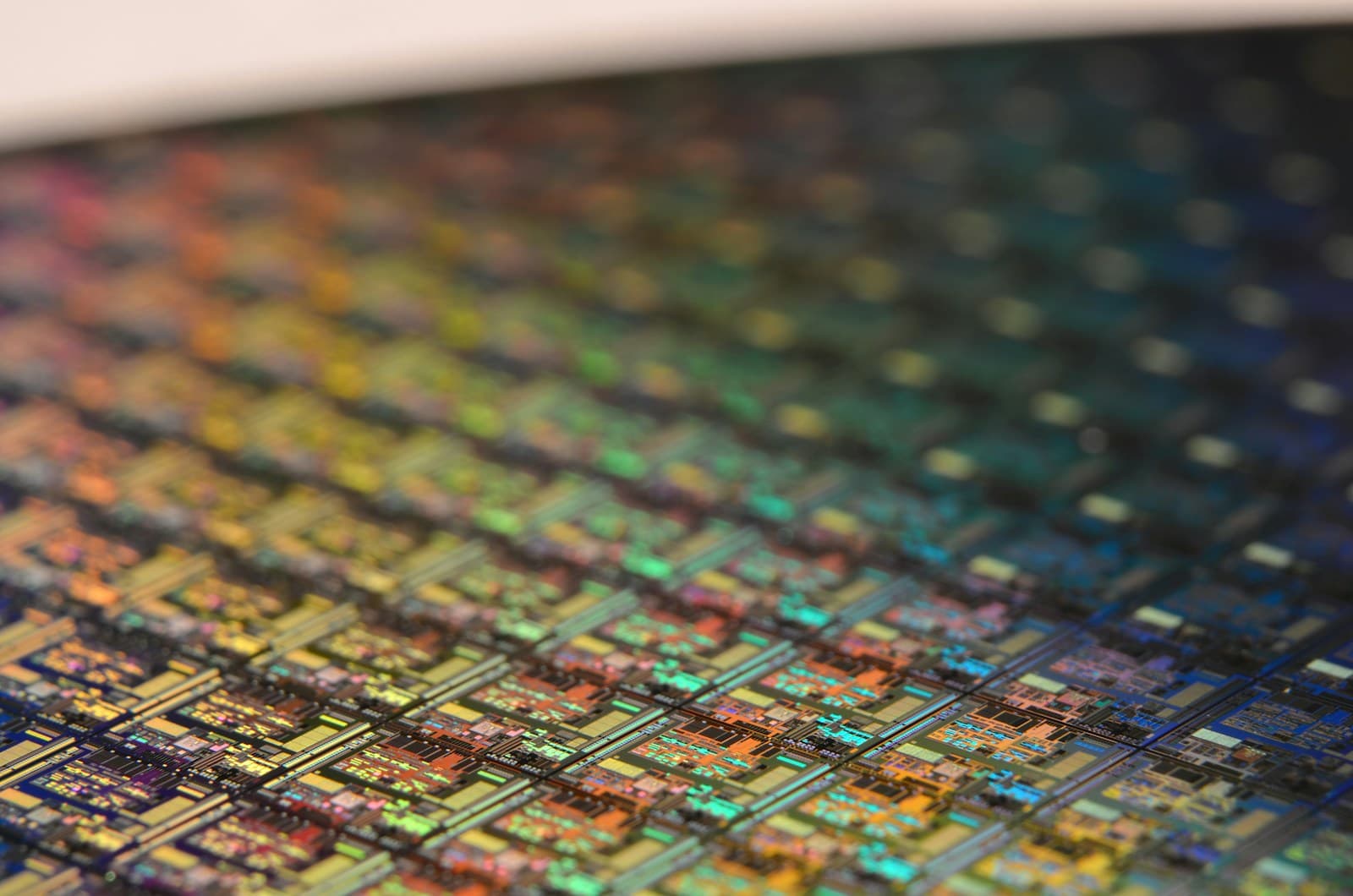 An angled array of semiconductor dies, the rows receding into shallow focus.